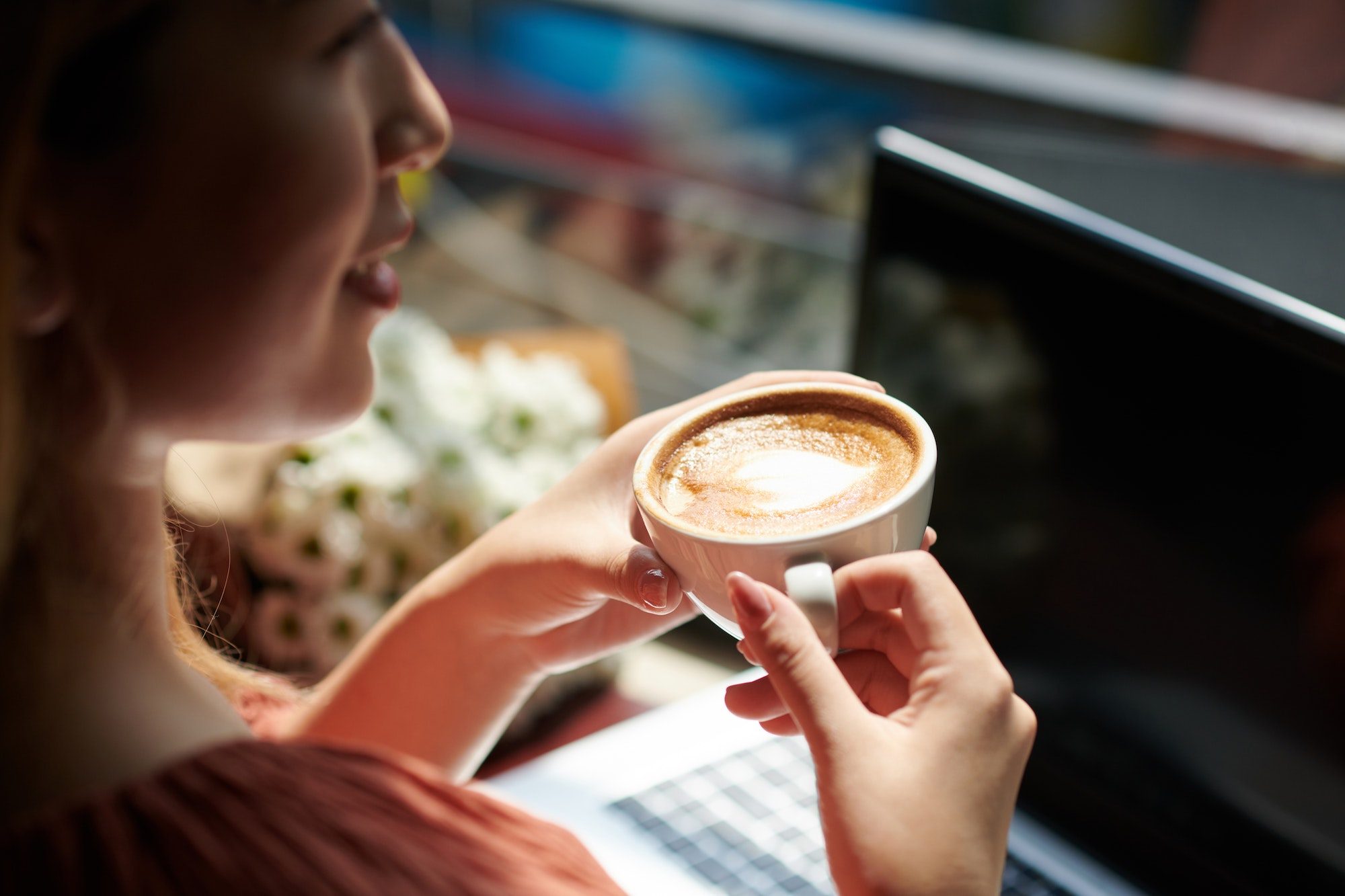Woman Drinking Coffee in Coffeeshop